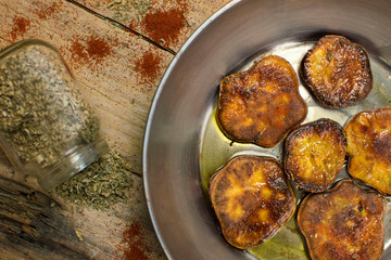 Baked sweet potato in a frying pan seen from above