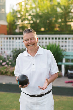 Happy senior woman lawn bowler portrait