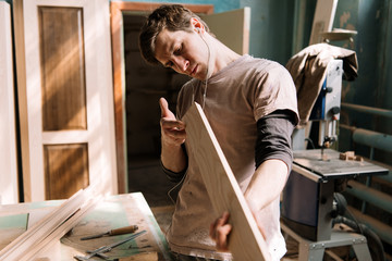 Craftsman looking at woodwork result