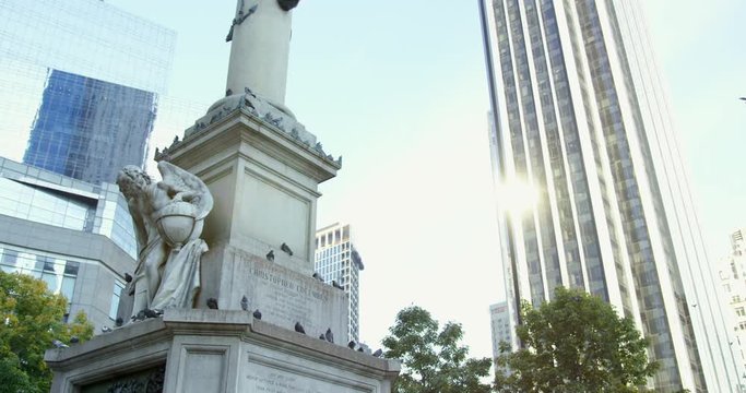 Christopher Columbus Monument In New York City, Manhattan. Famous Statue In NYC. Birds Flying Off The Statue On A Lovely Sunny Dau