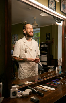 Laughing barber in front of mirror