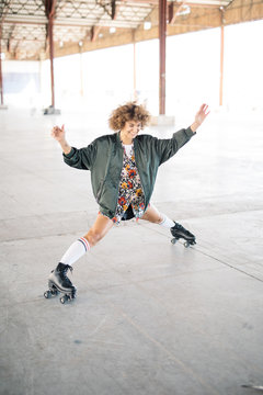 Excited girl skating in park
