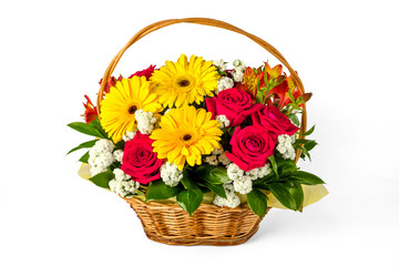 Fototapeta na wymiar Bouquet of gerberas and roses in a basket