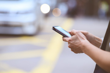 Woman use of mobile phone in city