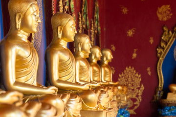 Row of Golden Thai's Buddha statue in Wat Bang Thong (Wat Mahathat Wachira Mongkol). It is a beautiful Buddhist temple and famous temple in Krabi, Thailand