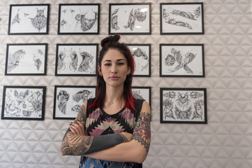 Confident tattoo master in studio
