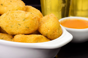 Traditional recipe codfish balls in a pub table