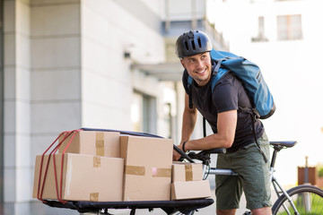 Bicycle messenger making a delivery on a cargo bike