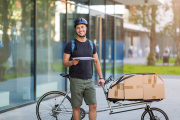 Bicycle messenger making a delivery on a cargo bike