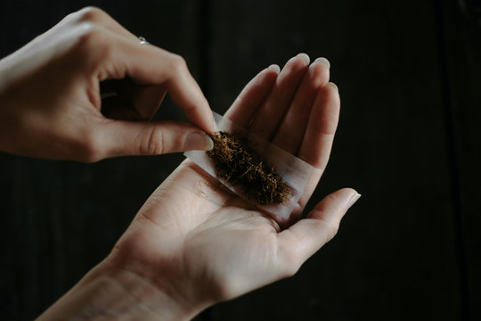 Young woman making a roll-up