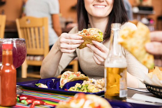 Cinco: Friends Eating Shrimp And Chicken Tacos At Dinner