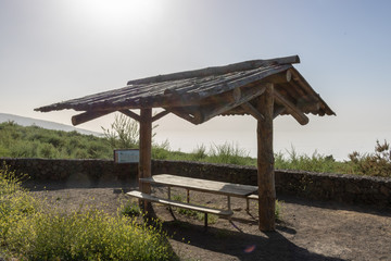 wooden canopy with table and benches on observation deck