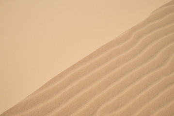 Abstract background of wind effect on dunes at desert.