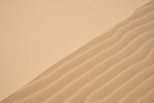 Abstract background of wind effect on dunes at desert.