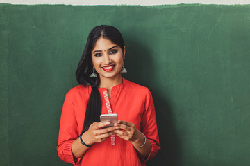 Young Woman Holding Smartphone