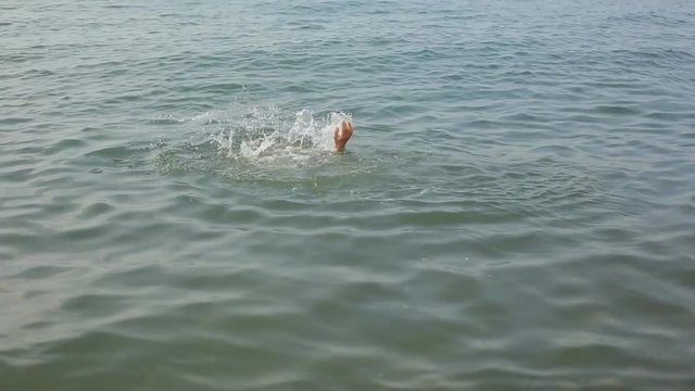 man swimming in the sea, rest on the water