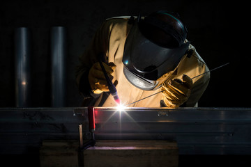 Welder at work in his workshop