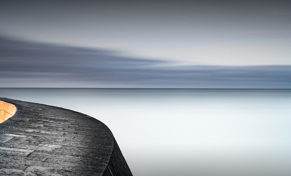 Harbour wall and calm sea