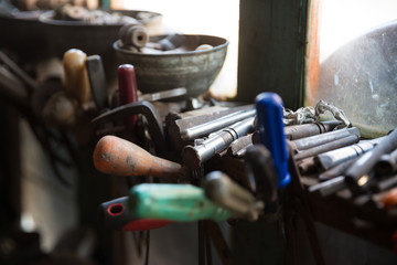 Coppersmith workshop and hand made copper things, Lahich, Azerbaijan. Interior of coppersmith workshop in the village.