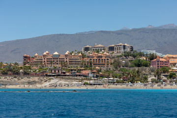Beautiful rocks at beach with waves and blue water in Teneriffa
