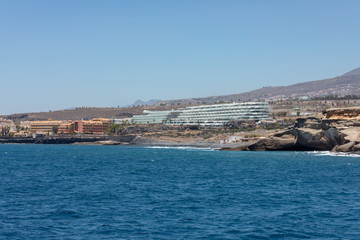 Beautiful rocks at beach with waves and blue water in Teneriffa