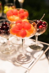 spring / summer appetizer table with fresh fruit cocktails 
