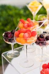 spring / summer appetizer table with fresh fruit cocktails 
