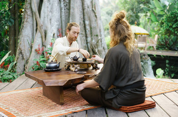 Men greeting each other on tea ceremony