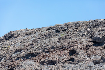 Beautiful rocks at beach with waves and blue water in Teneriffa