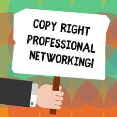 Conceptual hand writing showing Copy Right Professional Networking. Business photo showcasing Secure modern connection network Hu analysis Holding Colored Placard with Stick Text Space