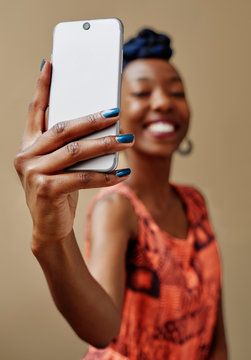 Young black woman taking a selfie.
