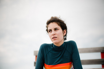 teenage girl sitting on a lifeguard chair