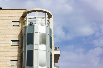 common living building apartment with glass balconies 