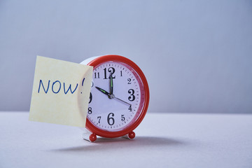 Time management deadline and schedule concept: alarm clock and stickers with different inscriptions