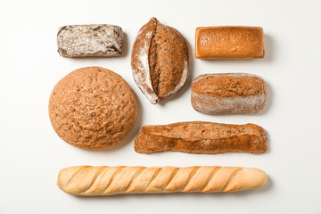 Flat lay composition with bakery products on white background, space for text