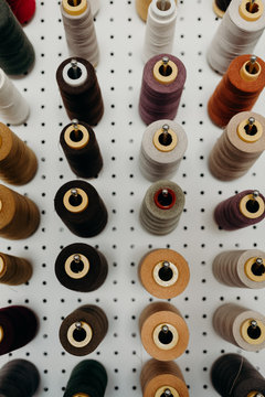 Multi-Color Spools of Thread on Pegboard
