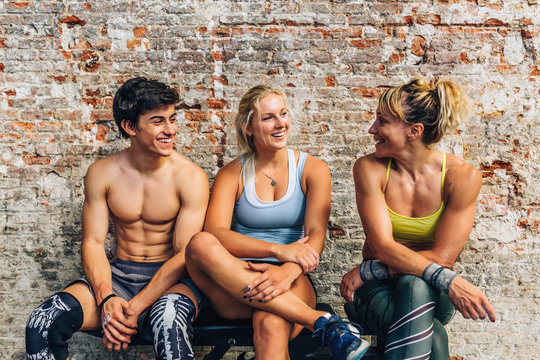 Athletes chatting on bench
