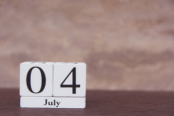 July 4 th. of American Independence Day with white block calendar on wooden table. copy space