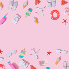 Creative composition made with various travel objects on pastel pink background. Summer vacation...