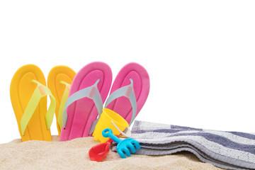 sandals with towel in the sand of the beach