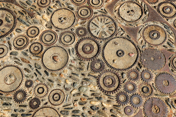 Floor with pattern from pebbles and rusty metal details