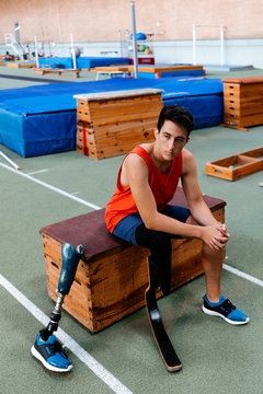 Disabled man athlete ready for training with leg prosthesis