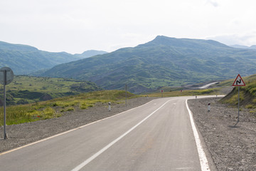 Mountain road. Shemakha mountain road in mountains. Cloudy sky with mountain road of Azerbaijan. Caucasus