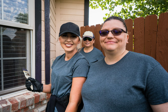 Volunteers Painting a House