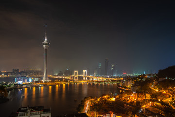Fototapeta premium Night view of the Macau Tower and skyline of Macau, China