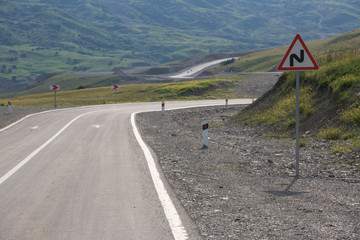 Mountain road. Shemakha mountain road in mountains. Cloudy sky with mountain road of Azerbaijan. Caucasus