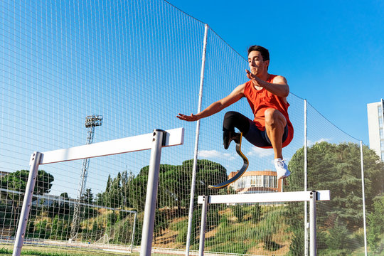 Disabled man athlete training with leg prosthesis