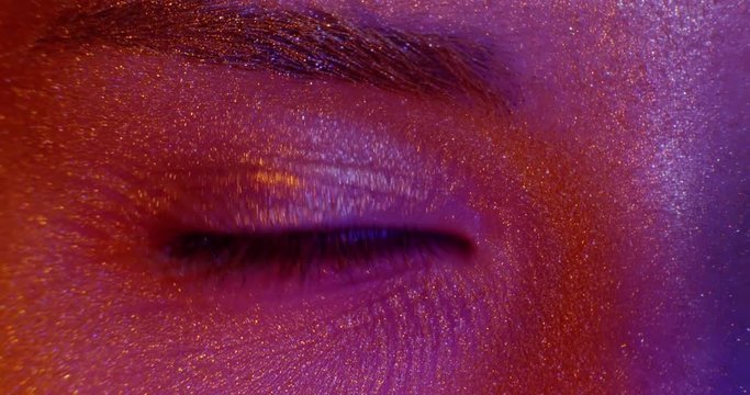 View Of Girl's Face With Beautiful Golden Body Art Looking To Camera, Eye. Macro.