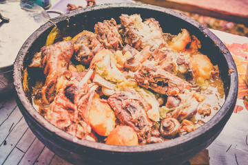 Lamb meat, potatoes and vegetables cooked on a grill, Serbian dish 