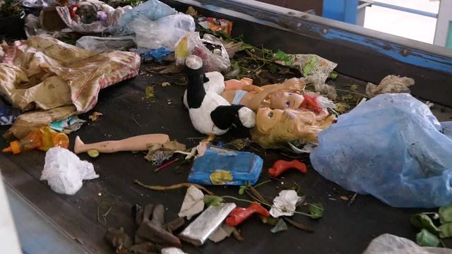 Recycling Plant. Broken Toys on Conveyor Belt